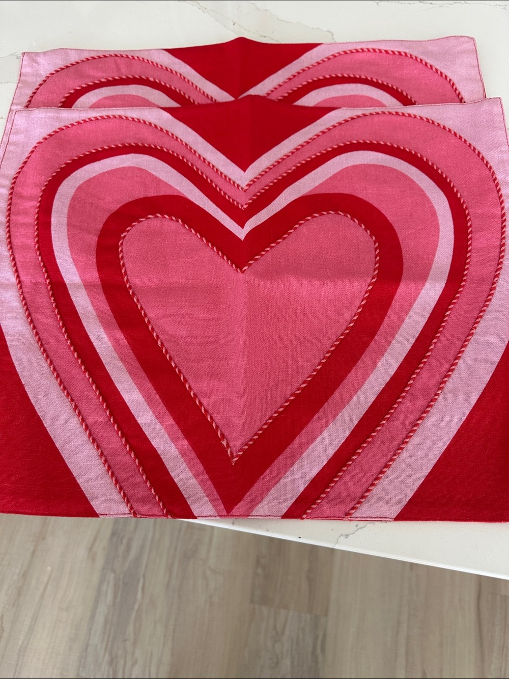 2 Bold Pink and Red Heart Print placemats.
